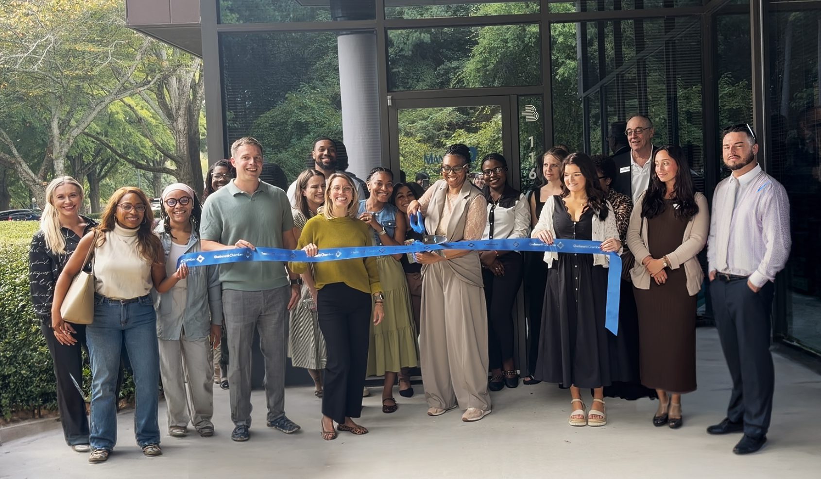 Team members cutting the ribbon at Manna Treatment's 2026 ribbon cutting ceremony